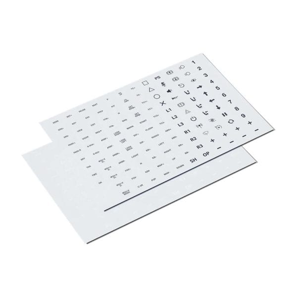 Twee vellen uit de Fanatec Button Caps and Sticker Set hebben zwarte symbolen en codes in nette rijen, licht overlappend.